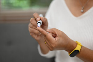 Woman Testing Blood Sugar for Diabetes and Colonoscopy Prep