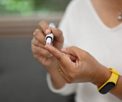 Woman Testing Blood Sugar for Diabetes and Colonoscopy Prep
